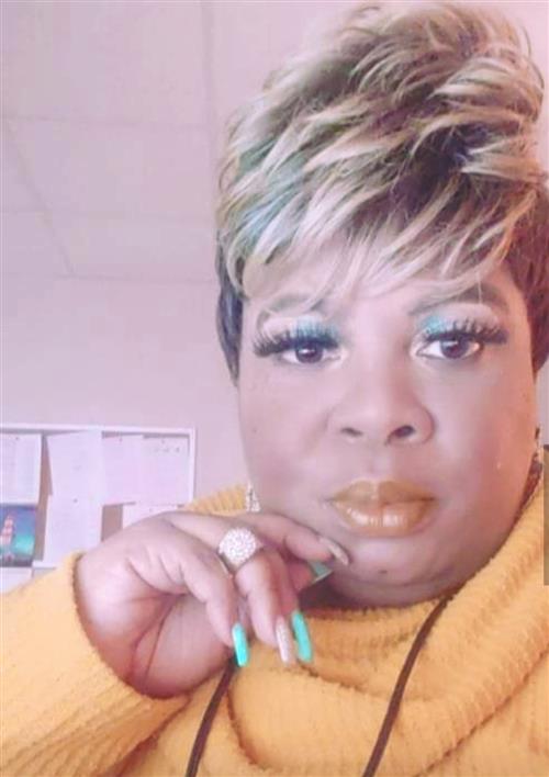Artisha looks to camera.